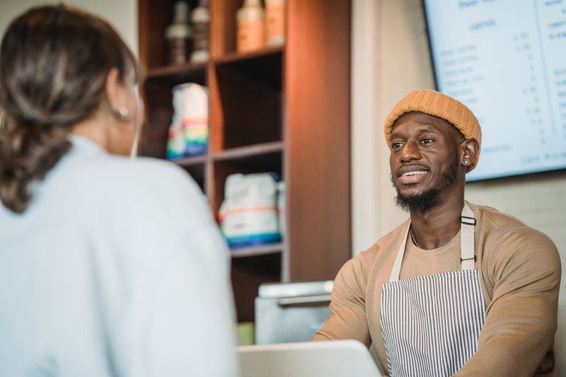 Wing Snob team member serving customers
